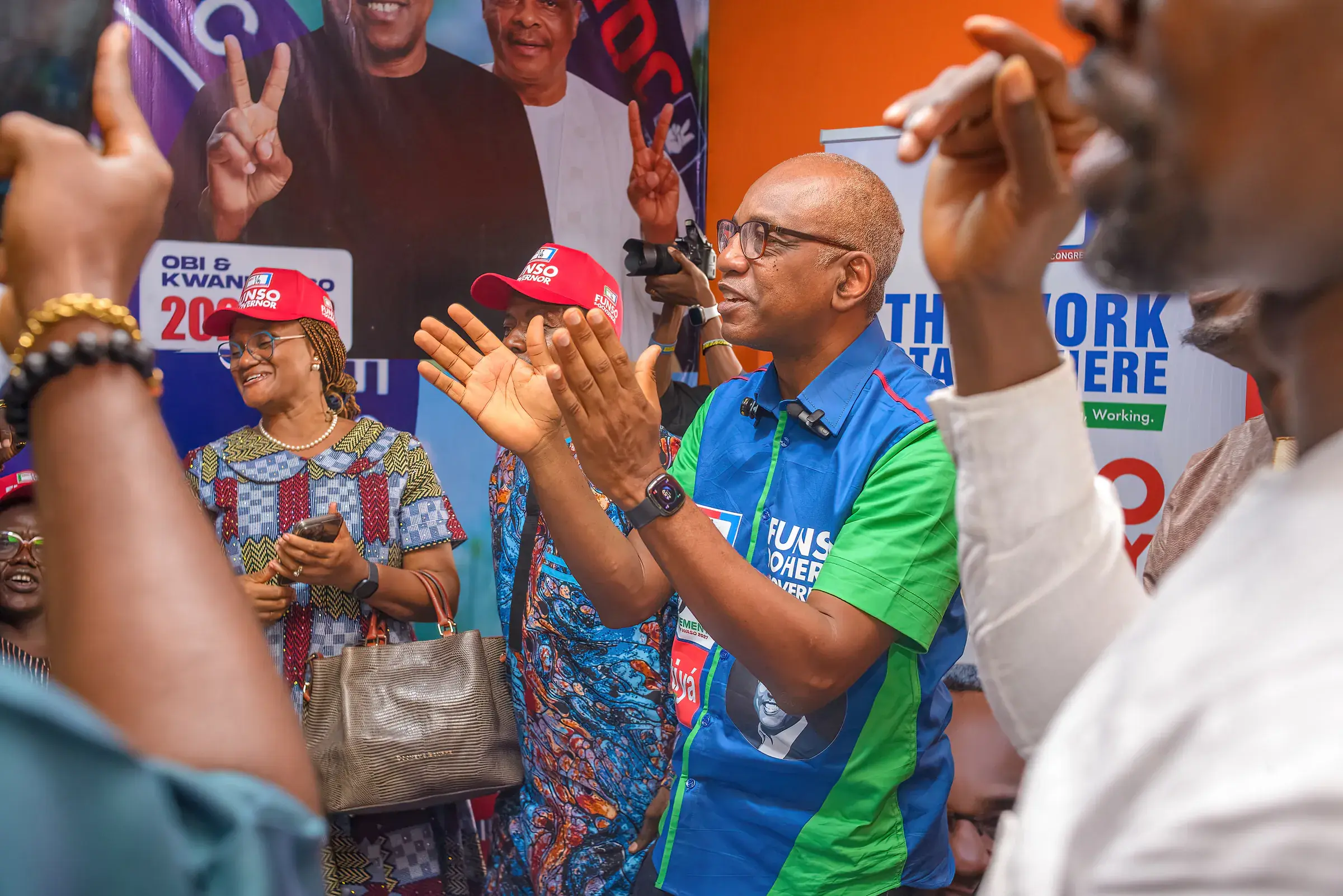 Funso Doherty with people during his visit to Alimosho.