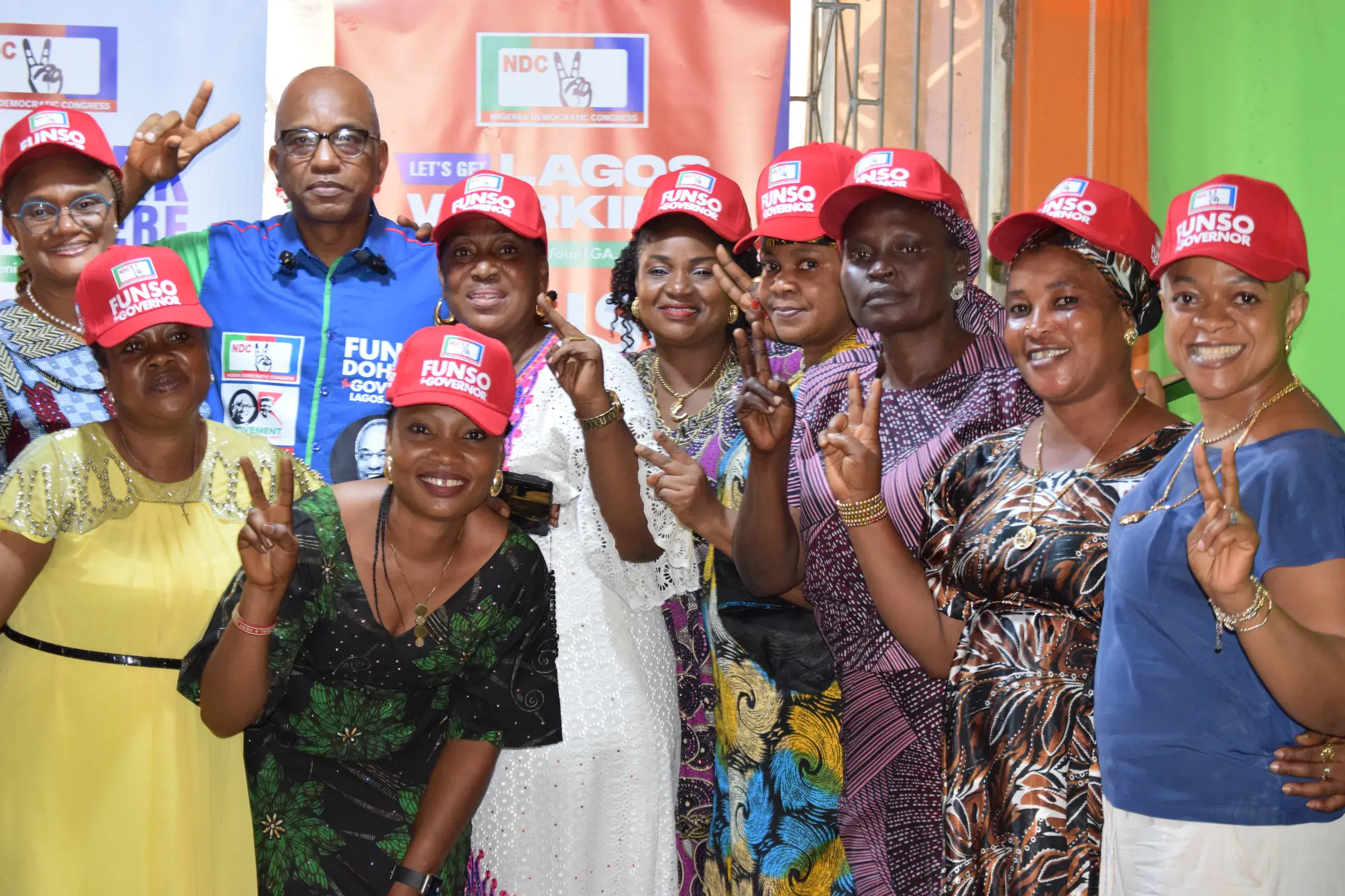 Funso Doherty with people during his visit to Alimosho.