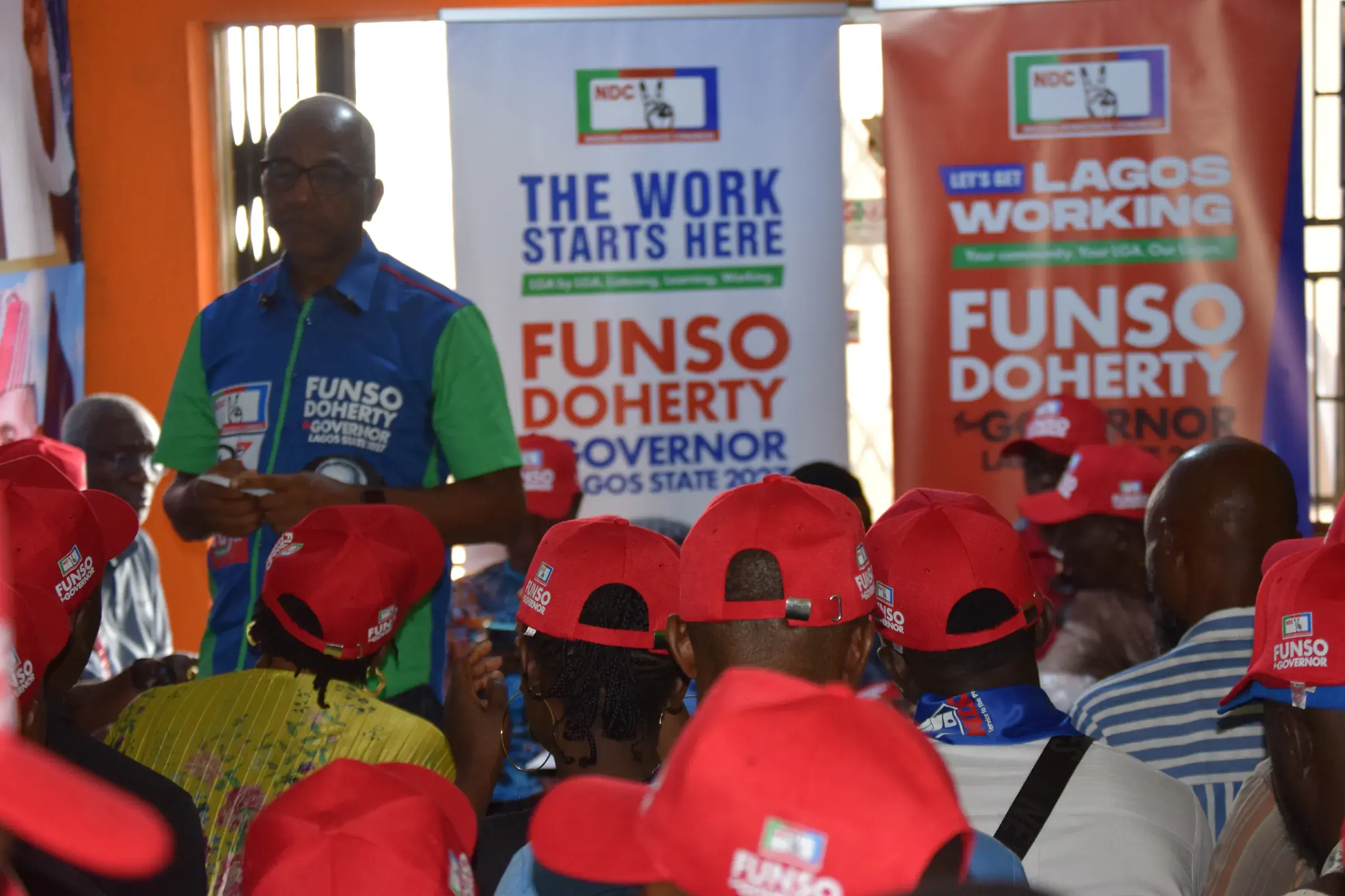 Funso Doherty with people during his visit to Alimosho.
