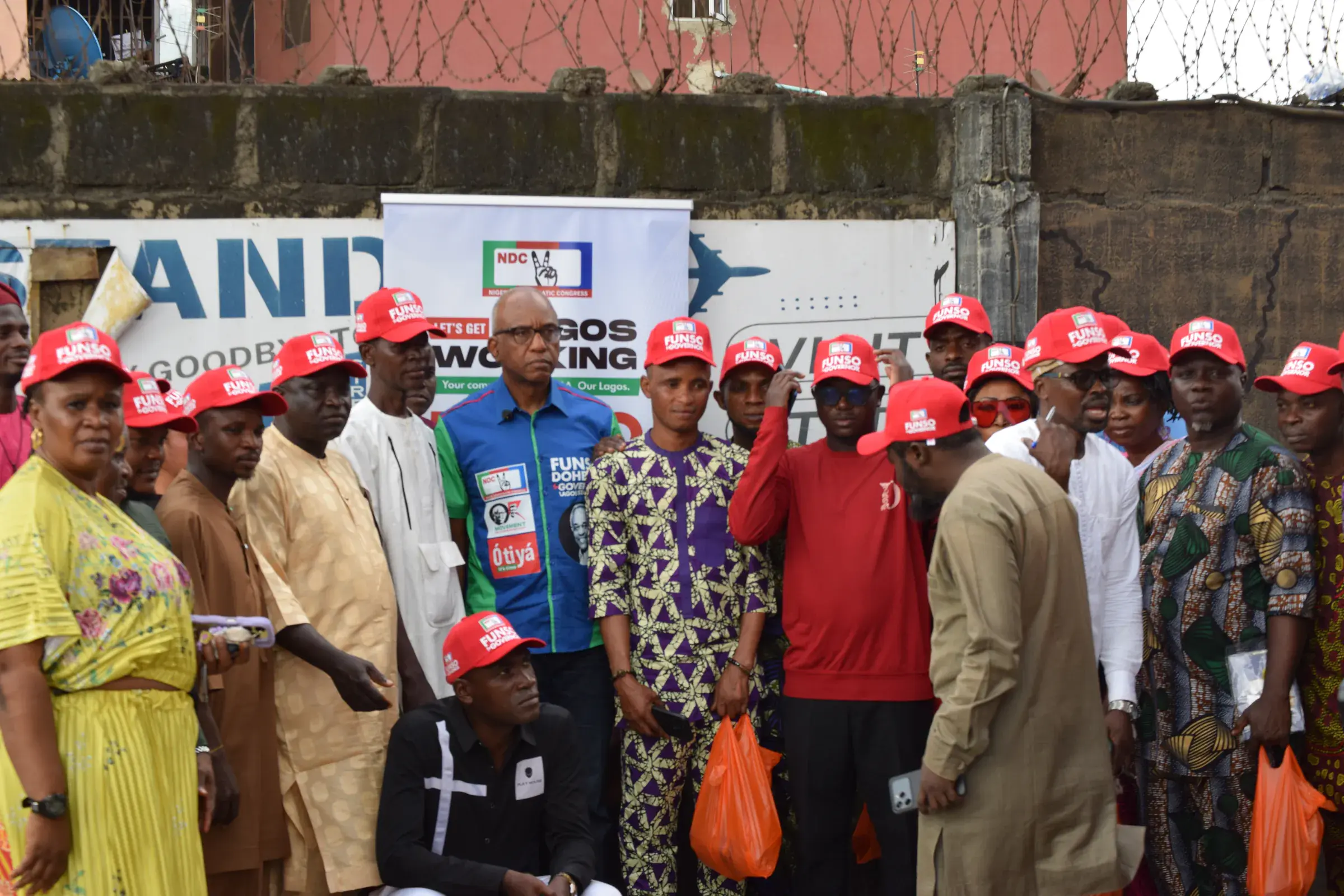 Funso Doherty with people during his visit to Alimosho.